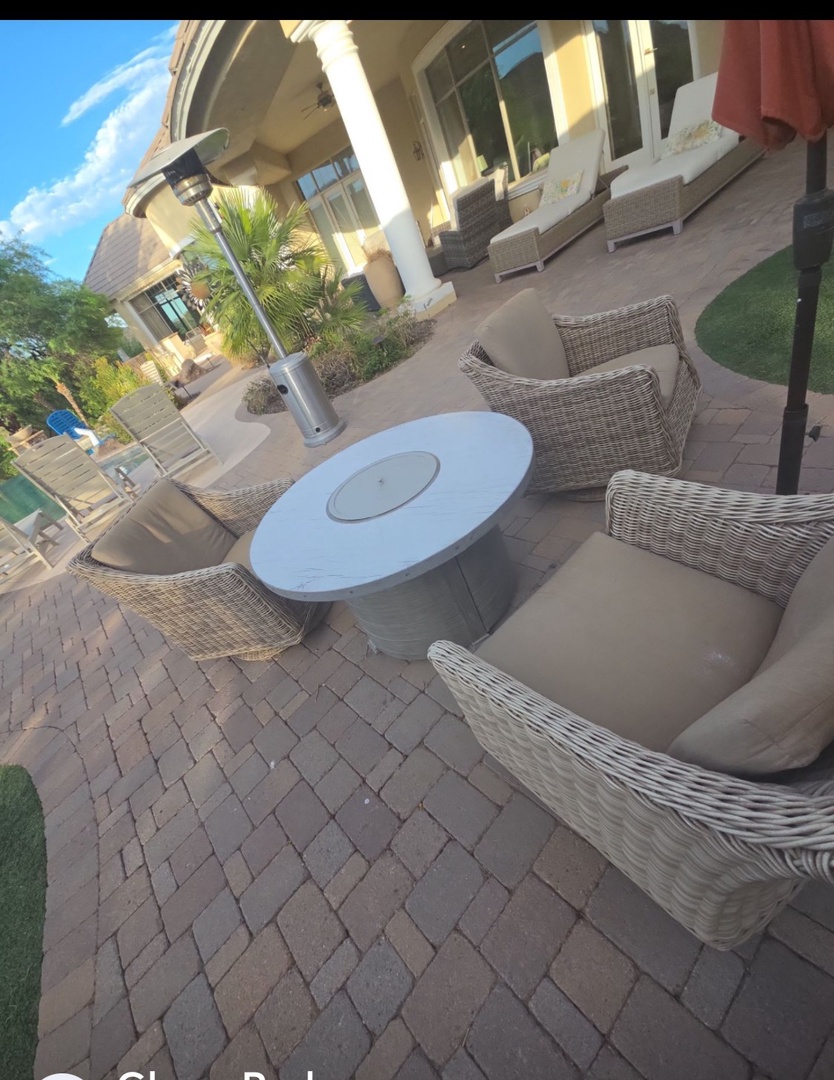 Relax outdoors in your private patio with plush wicker seating and a fire pit, surrounded by tropical palms and just steps from the pool.