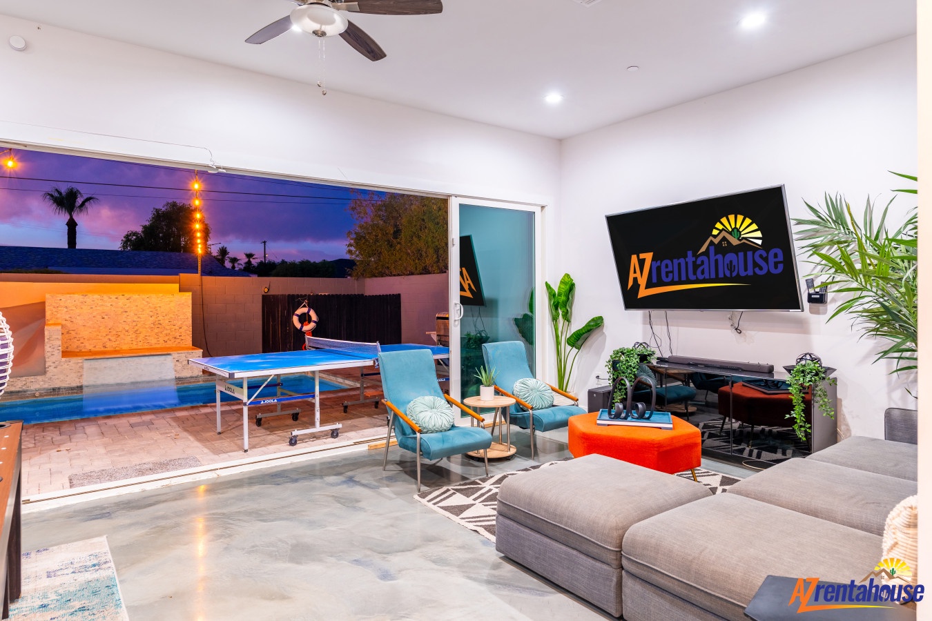 Unwind in your stylish living space with pool table fun, cozy seating, and seamless indoor-outdoor flow to your private backyard oasis.