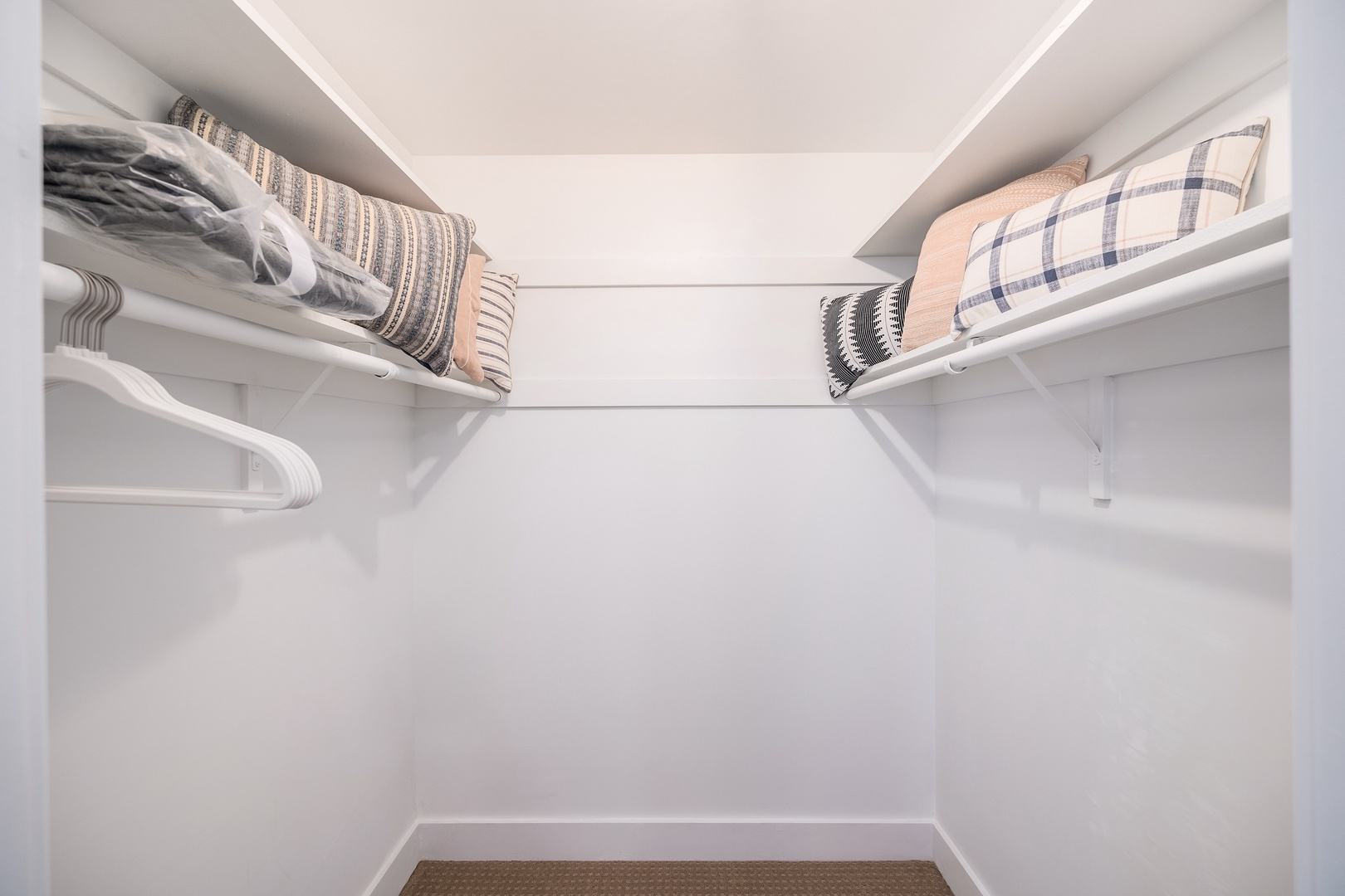 A spacious walk-in closet awaits with bright shelving and ample hanging space for your wardrobe. Extra storage lets you feel organized and settled in your home away from home.