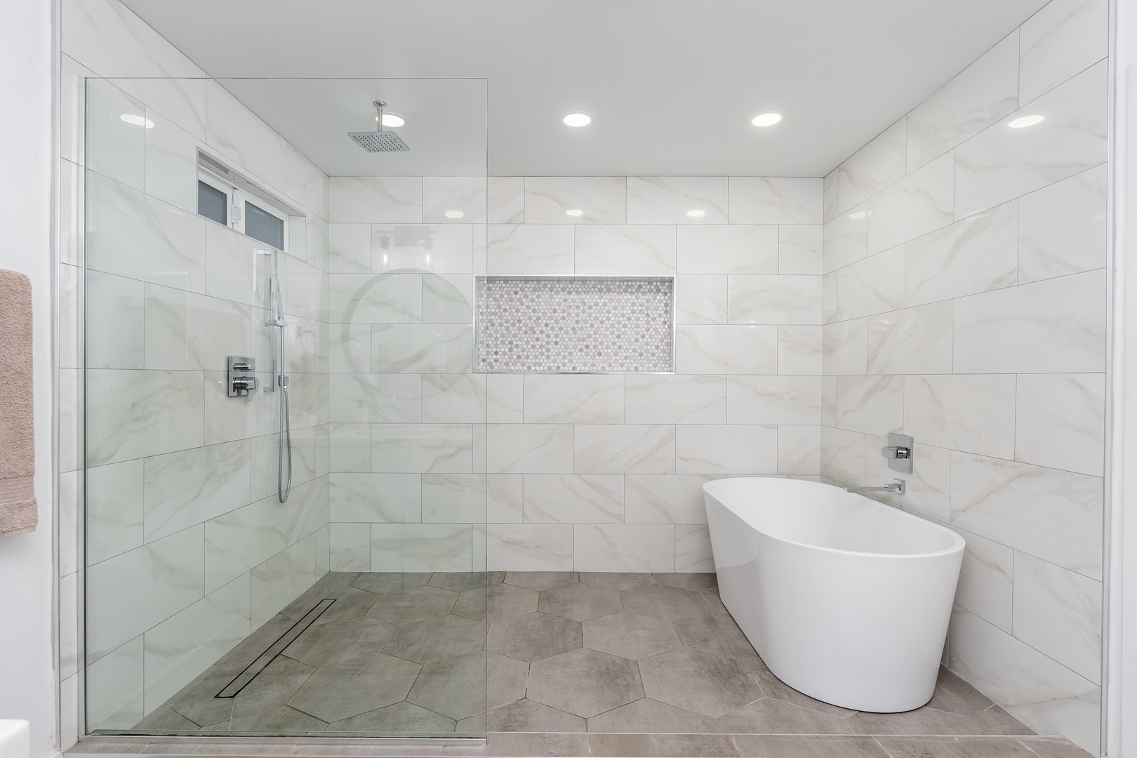 Unwind in your modern bathroom with elegant marble-effect tiles, a spacious walk-in shower, and a luxurious freestanding soaking tub—pure relaxation awaits.