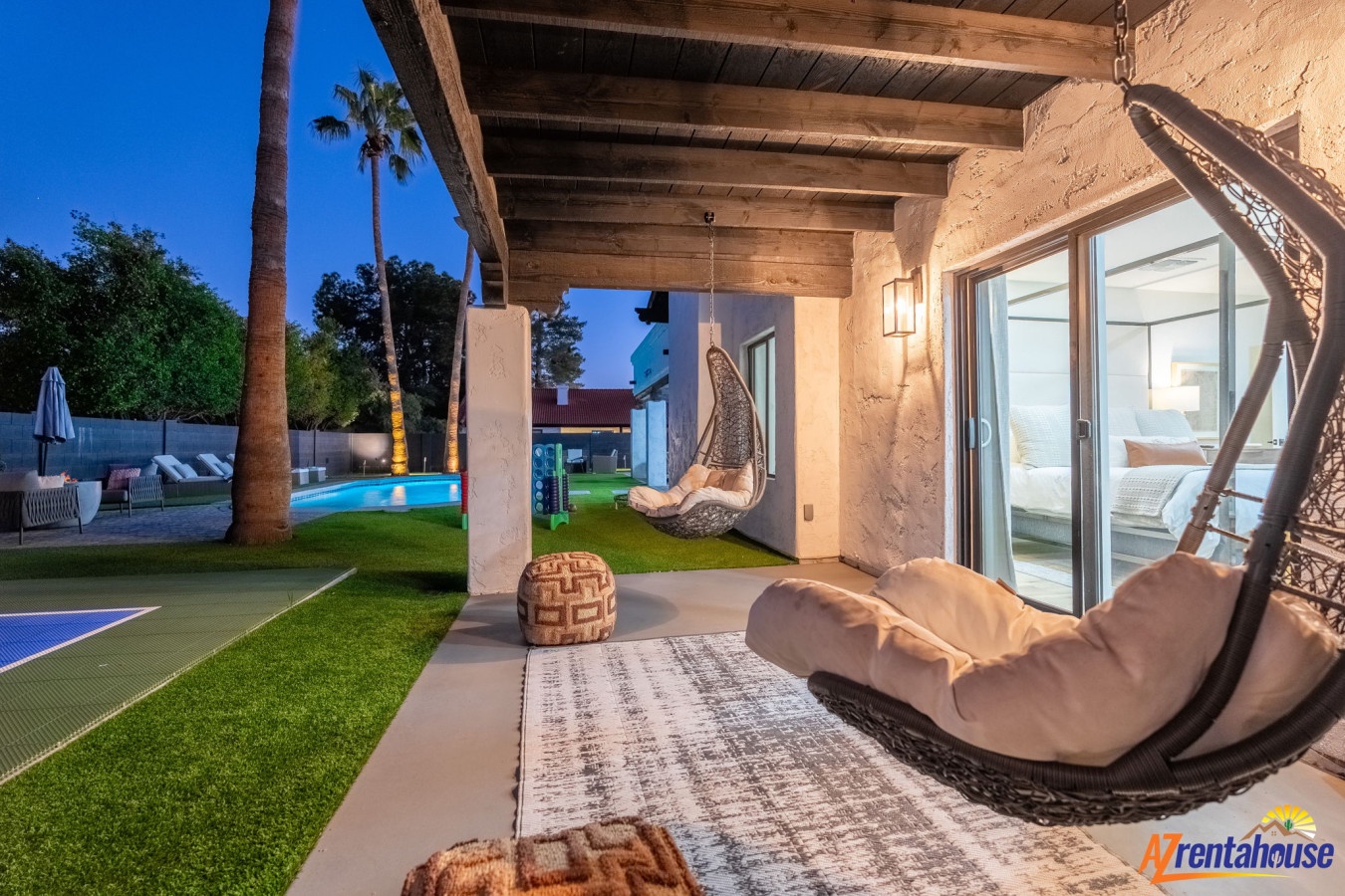 Unwind in your private oasis with stylish hanging chairs and pool views creating the perfect evening retreat.