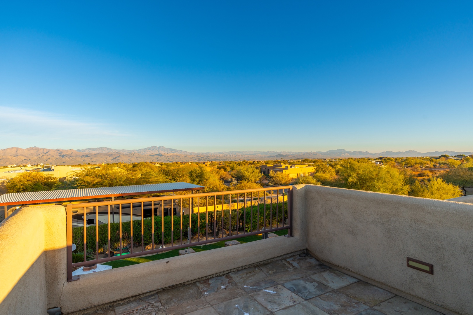 Rooftop terrace offering sweeping desert and mountain vistas under expansive Arizona skies—perfect for morning coffee or evening stargazing.