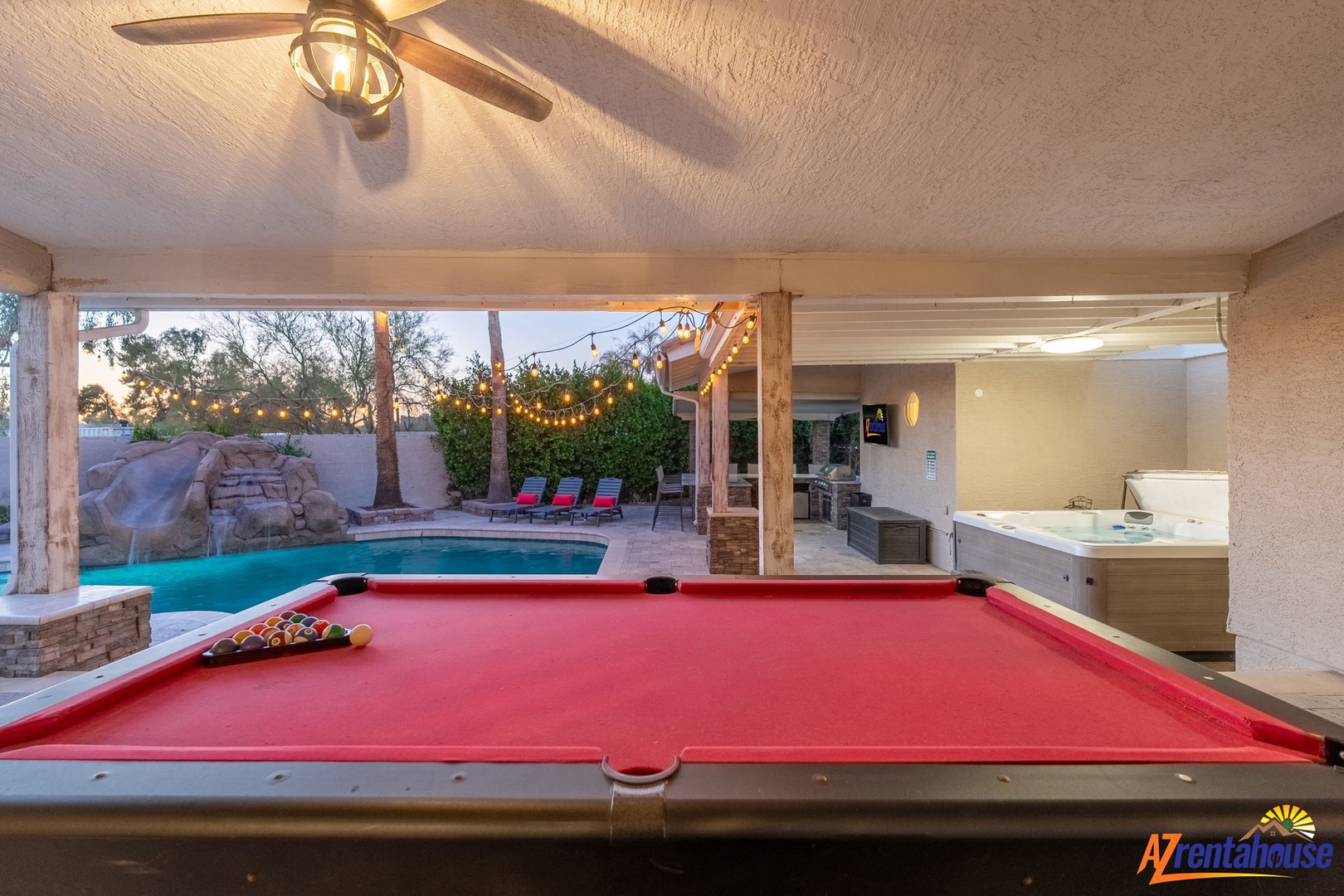 Rack 'em up for friendly competition, then step outside to your private pool oasis with hot tub, waterfall, and twinkling lights perfect for unforgettable evenings.
