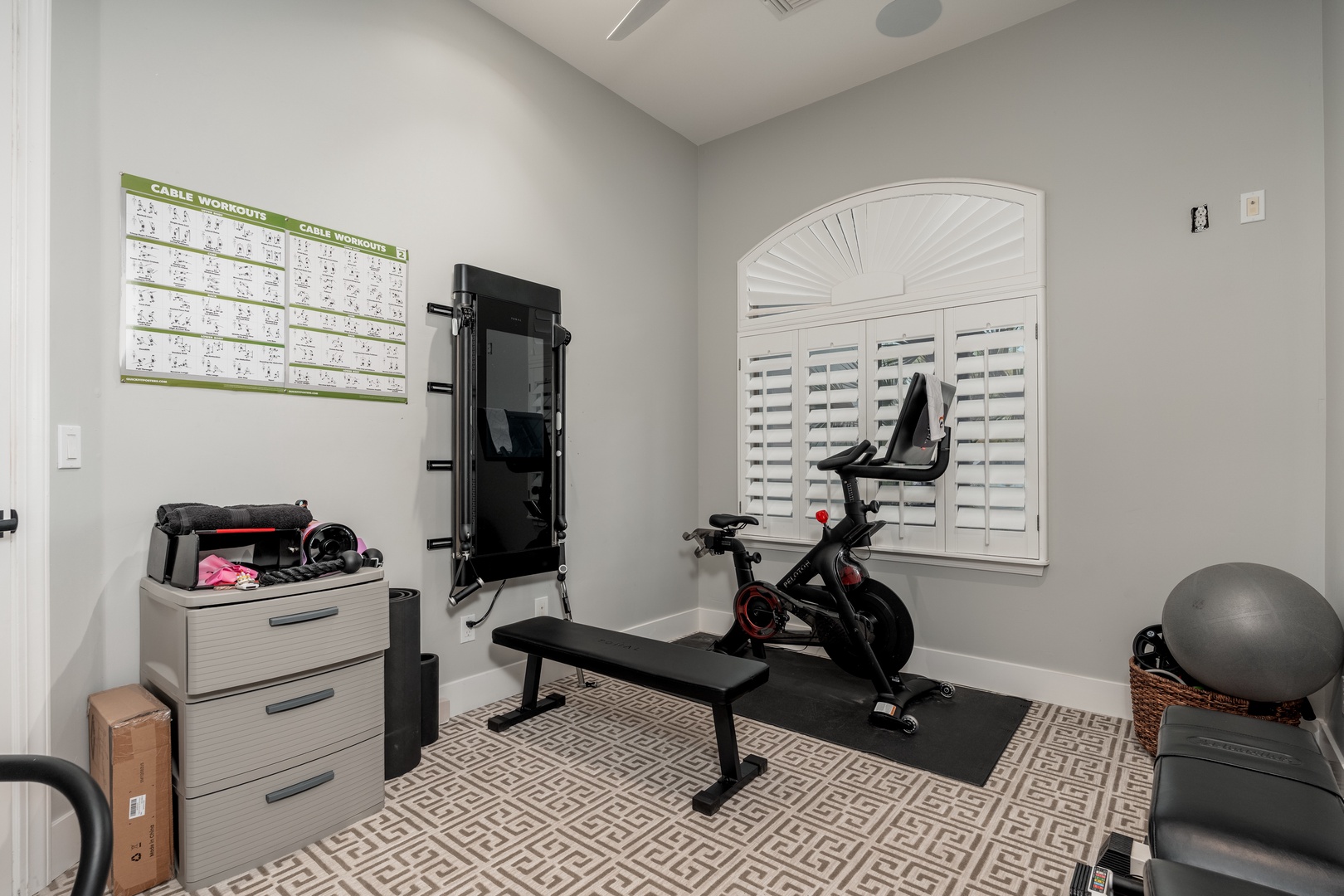 Stay fit in your private workout space with a spin bike, weights, and bench—everything you need for an energizing morning routine or evening wind-down.