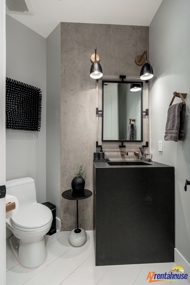 Step into your sleek modern bathroom featuring elegant concrete accents, sophisticated lighting, and thoughtful design touches that create a spa-like retreat.