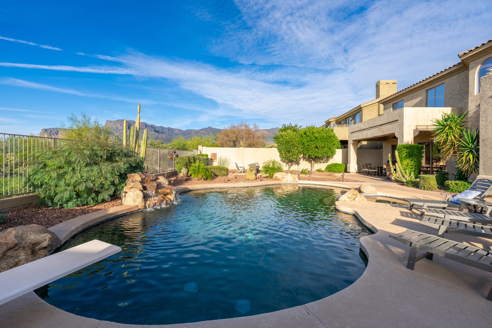 Dive into your private desert oasis—lounge poolside as mountain views frame your perfect Arizona escape, complete with a sparkling pool and sunny deck.