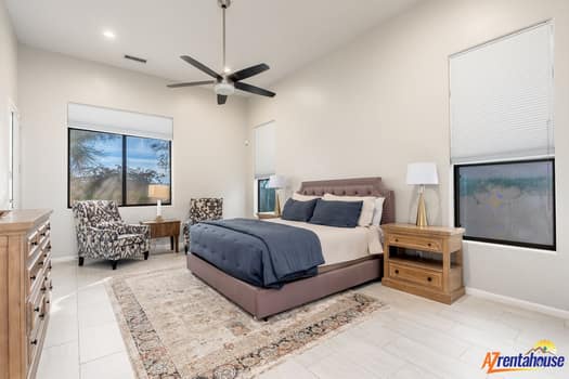 Your private bedroom retreat features a cozy king bed, ceiling fan, and charming window views to help you unwind after adventures.