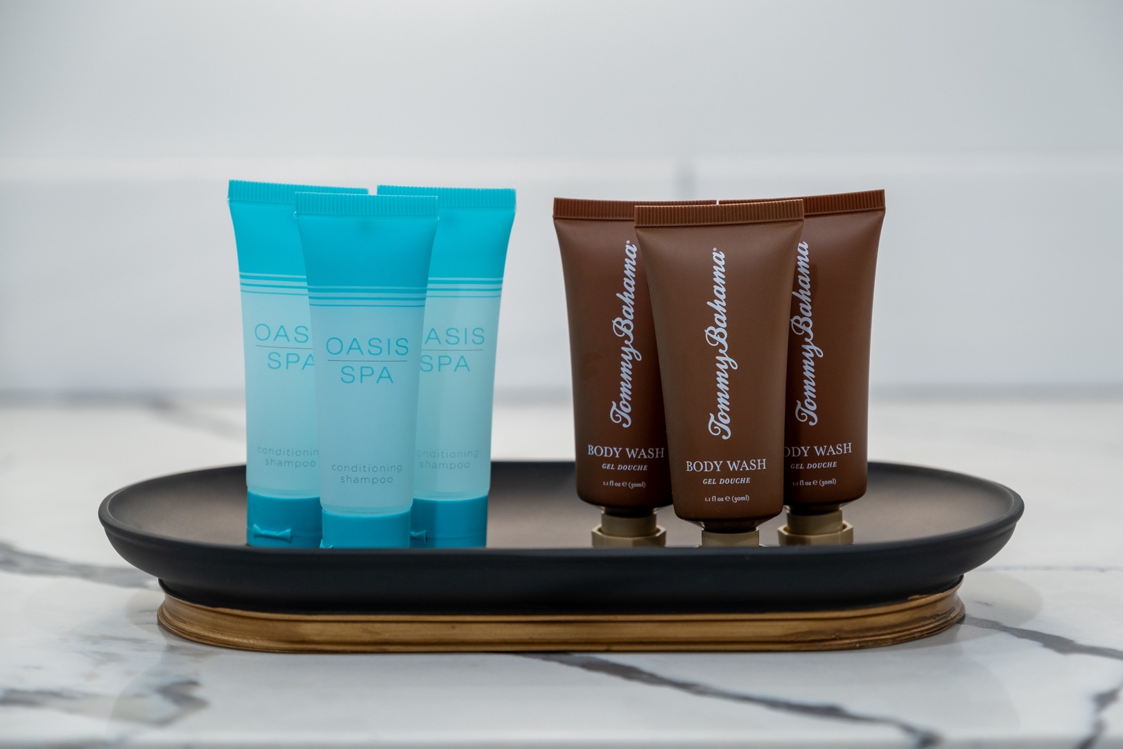 Premium toiletries await your arrival, featuring Oasis Spa shampoo and conditioner alongside Tommy Bahama body wash—everything you need to refresh after a day of adventure.