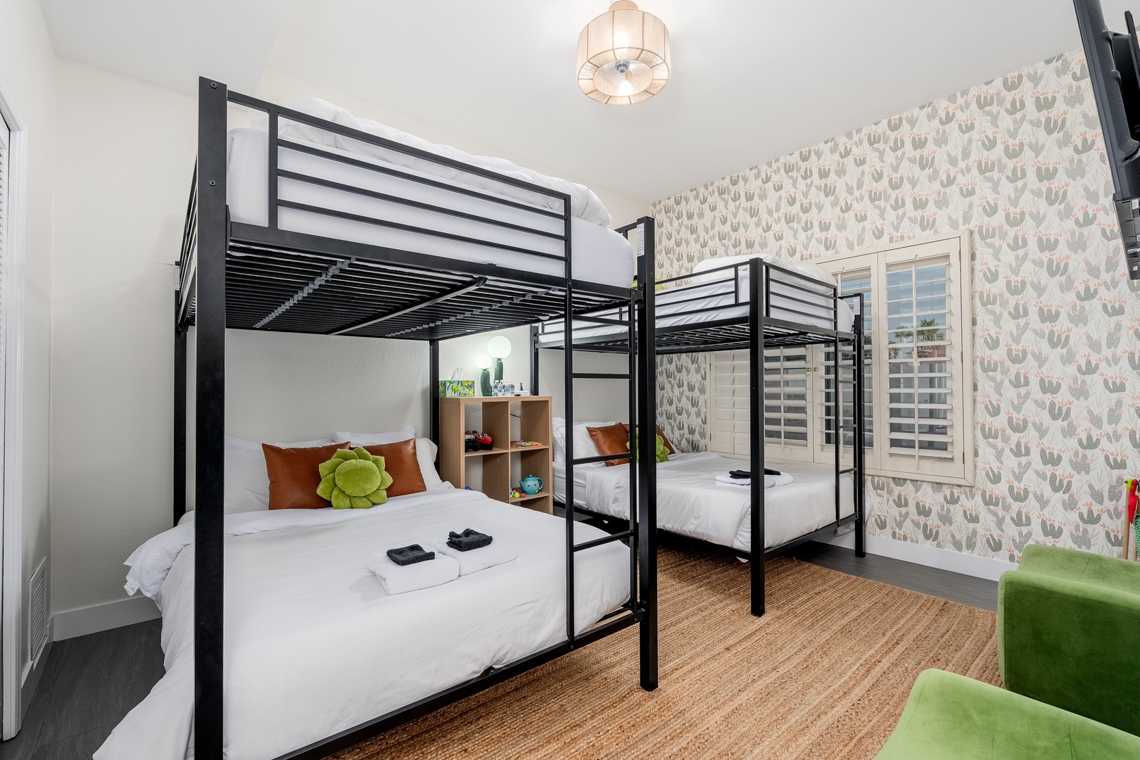 Your cozy bunk room offers fresh linens, playful accents, and cheerful wallpaper—perfect for families or groups seeking comfort and fun together.