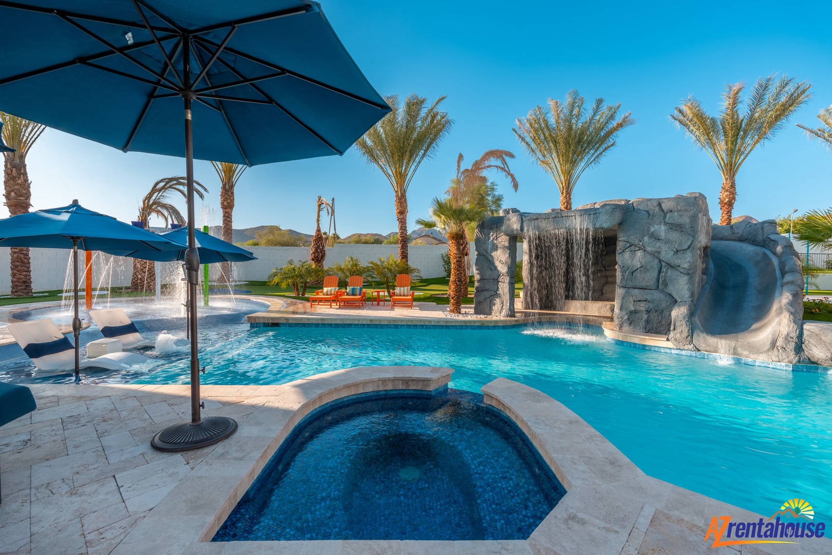 Your private desert oasis awaits with a stunning pool, relaxing spa, and tropical palms creating the perfect backyard retreat.