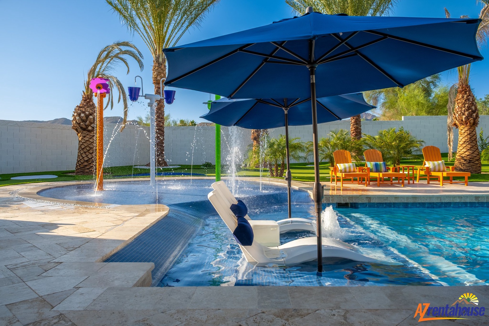Dive into your private oasis with playful splash features, palm shade, and vibrant poolside lounging under sunny desert skies.