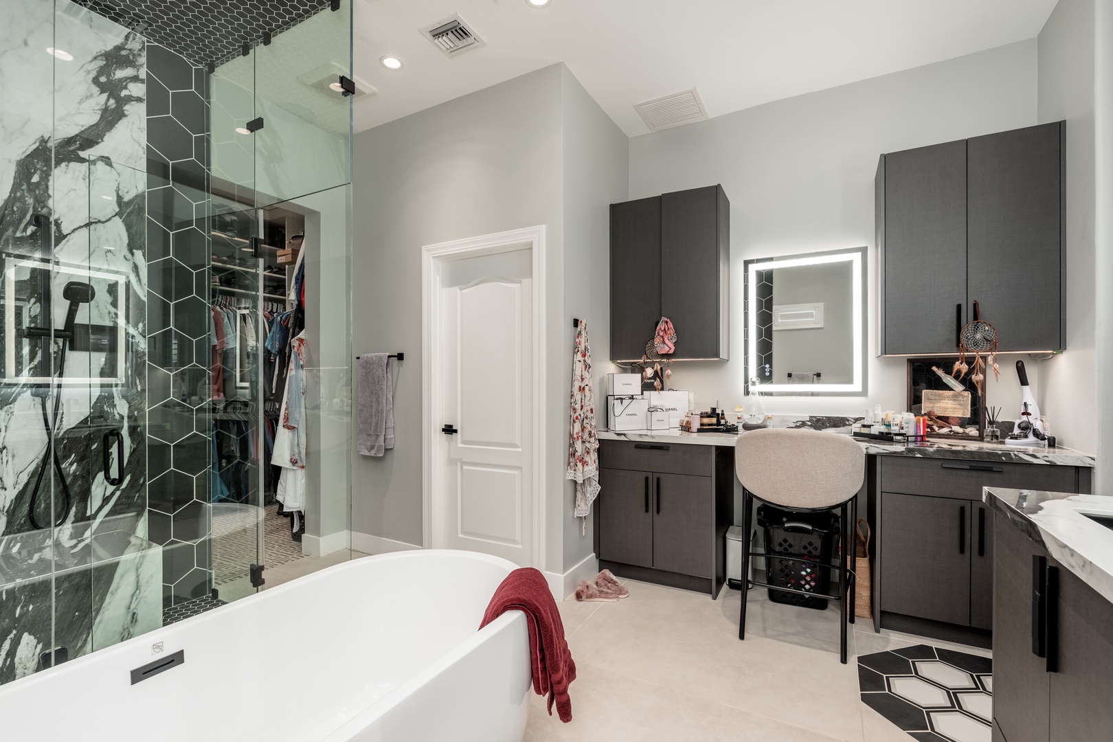 Indulge in a luxurious spa-like retreat with a soaking tub, rainfall shower, and elegant vanity—your personal sanctuary for unwinding after each day's adventures.