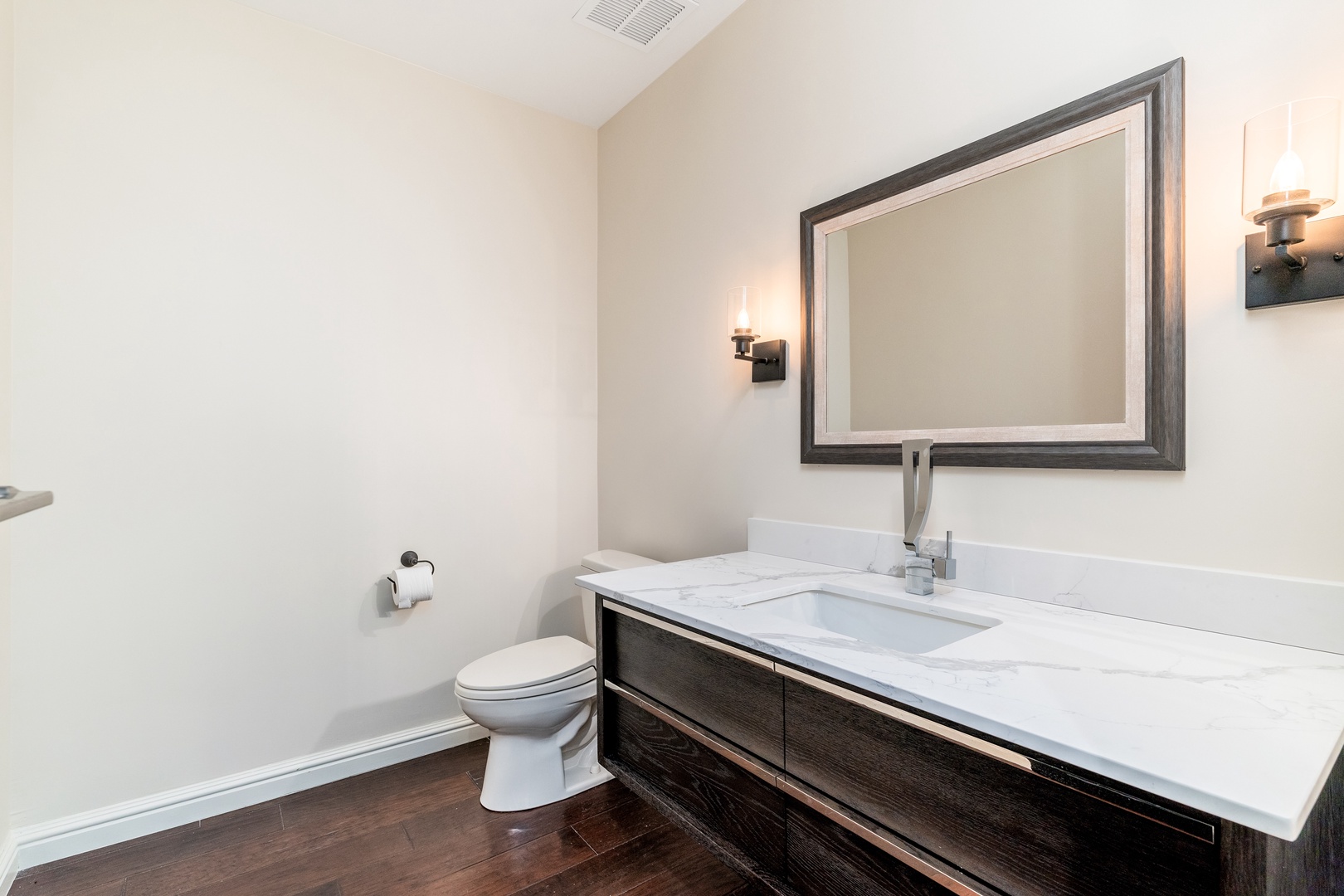 Your private bathroom features a spacious marble vanity, elegant lighting, and a clean, modern design to help you feel refreshed and ready for the day.