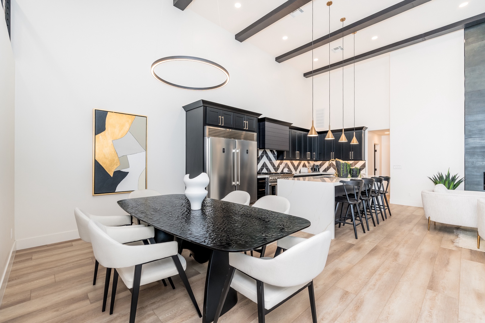 Gather around this elegant dining table for meals with your group, while the open kitchen lets everyone stay connected as they cook and socialize together.