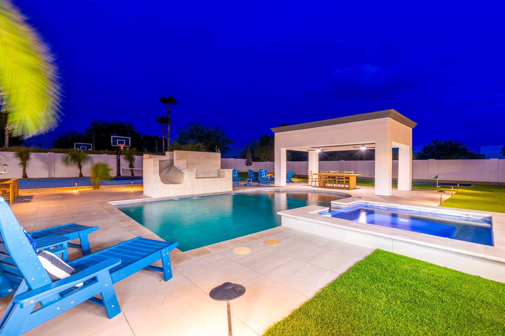 This stunning backyard oasis awaits, featuring a sparkling pool, hot tub, poolside gazebo, and basketball court—perfect for unforgettable evenings under the stars.