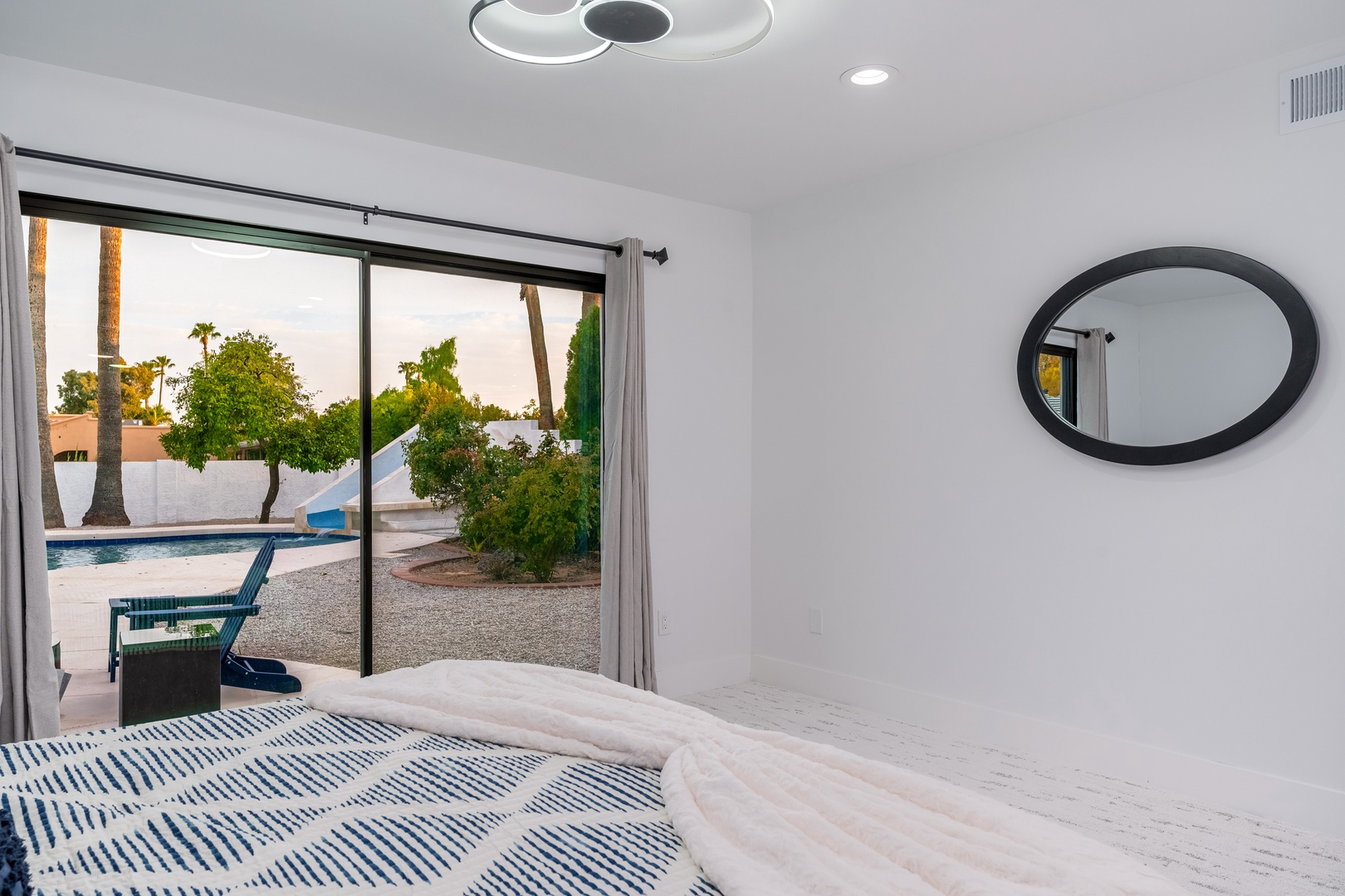 Wake up to peaceful pool views and step directly onto your private patio, where sunny mornings and evening dips await just beyond your sliding doors.