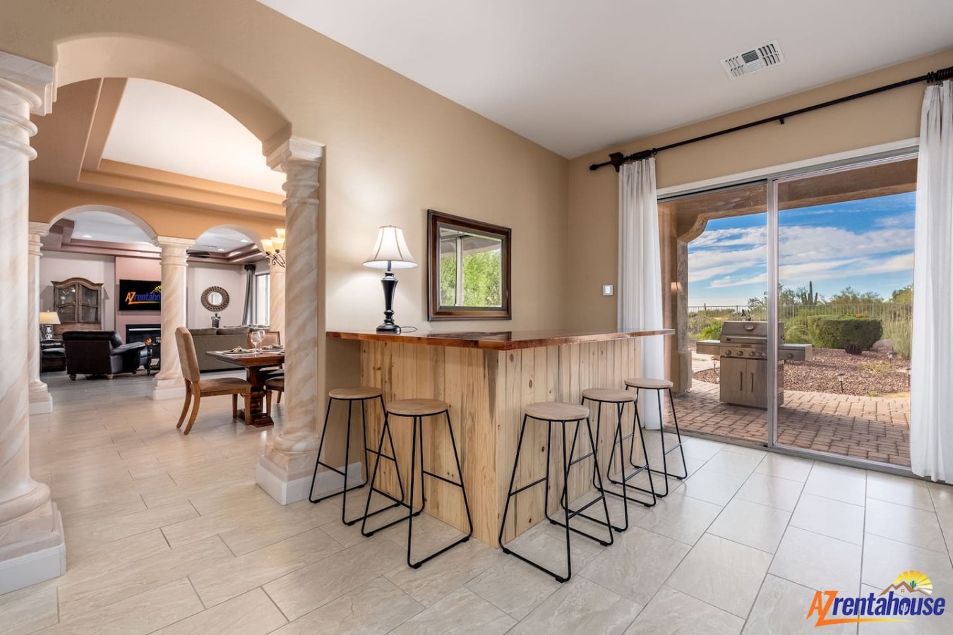 Gather around your stylish breakfast bar for morning coffee while soaking in stunning desert views through floor-to-ceiling windows.