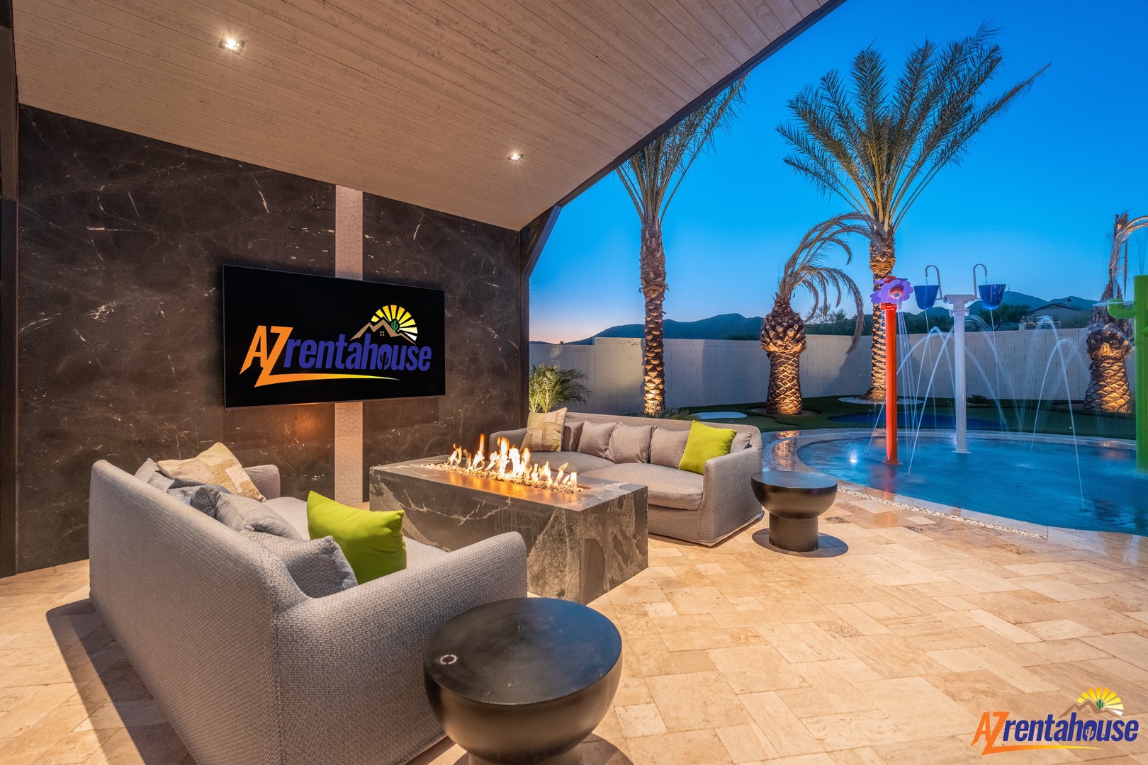 Your private outdoor oasis awaits—cozy up by the fireplace while admiring the sparkling pool and mountain views at dusk.