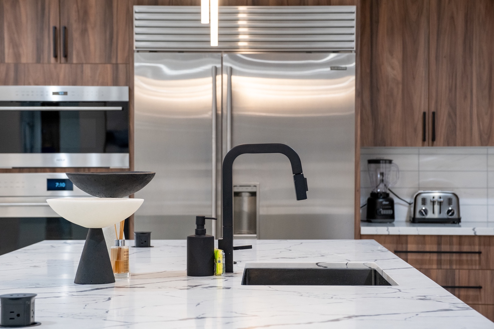 Picture yourself preparing meals in your modern, fully equipped kitchen with high-end stainless appliances, sleek countertops, and contemporary fixtures ready for all your culinary adventures.