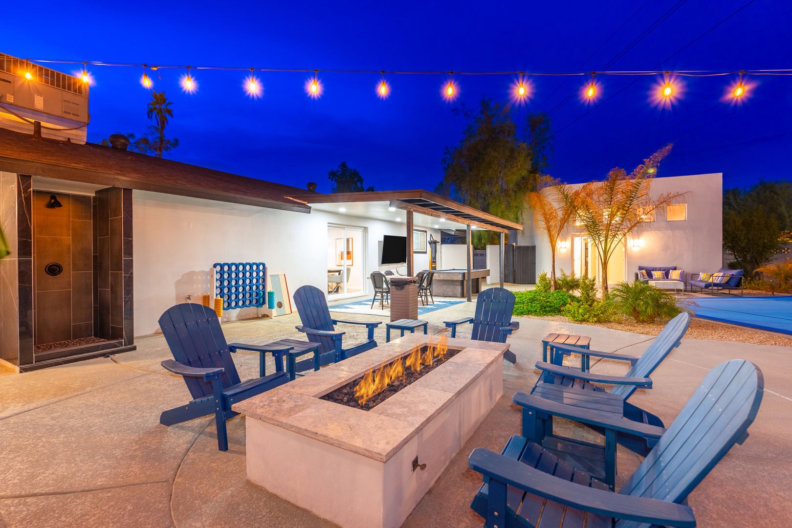 Gather around your private fire pit under twinkling lights—perfect for evening conversations, toasting marshmallows, or simply unwinding beneath the desert sky with friends and family.