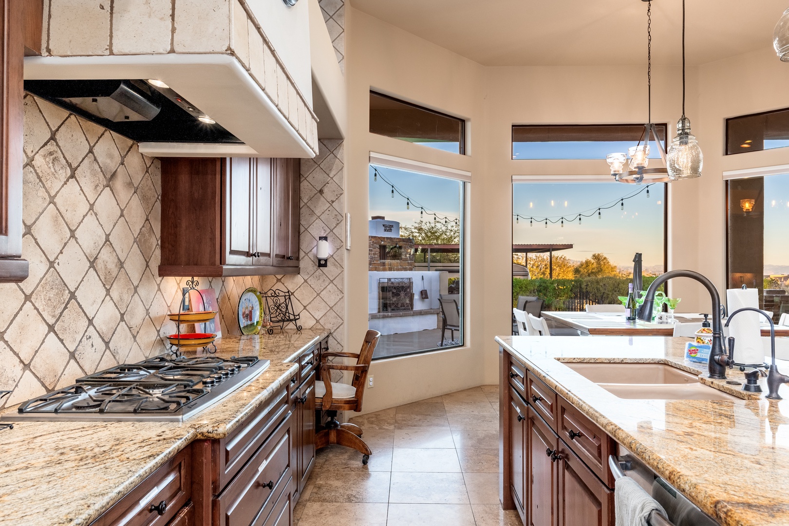 Step into a gourmet kitchen where your culinary dreams come alive, with granite counters, professional-grade appliances, and windows framing serene outdoor views that inspire every meal you create.