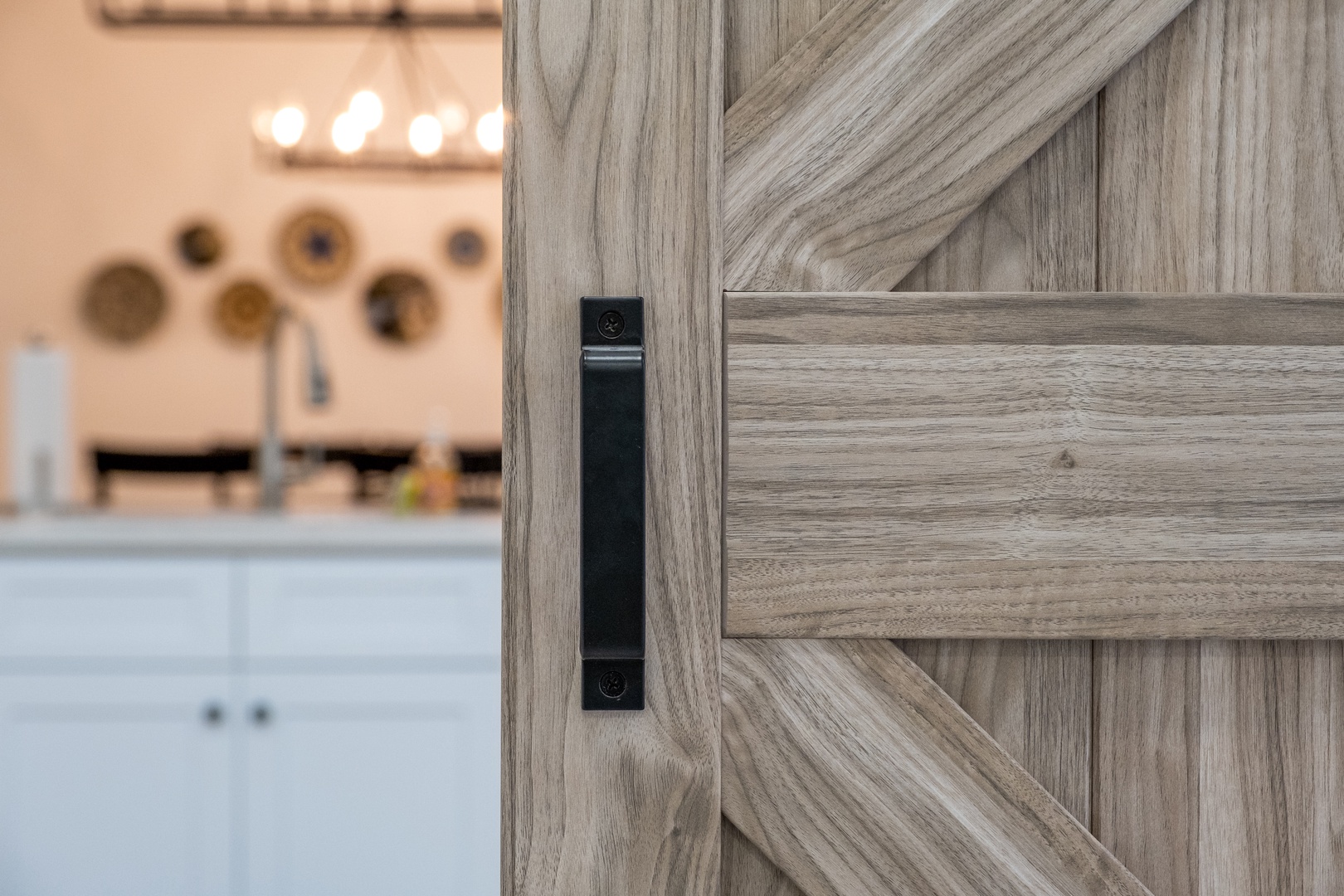Step into your inviting kitchen space, where rustic barn doors meet modern elegance. The charming wood-grain detail adds warmth and character to your culinary retreat.