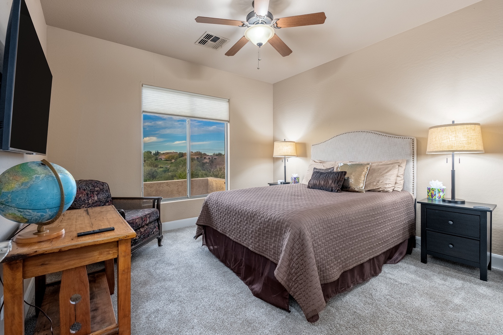 Unwind in your peaceful bedroom with desert views, cozy linens, and soft lighting to help you relax after your day of adventure.