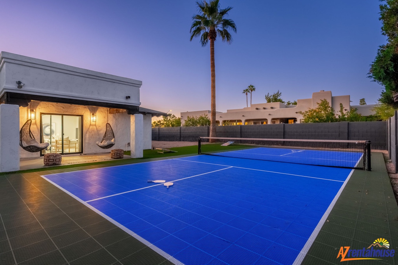 Your private oasis awaits with a stunning tennis court beneath desert palms, perfect for sunset matches and poolside relaxation.