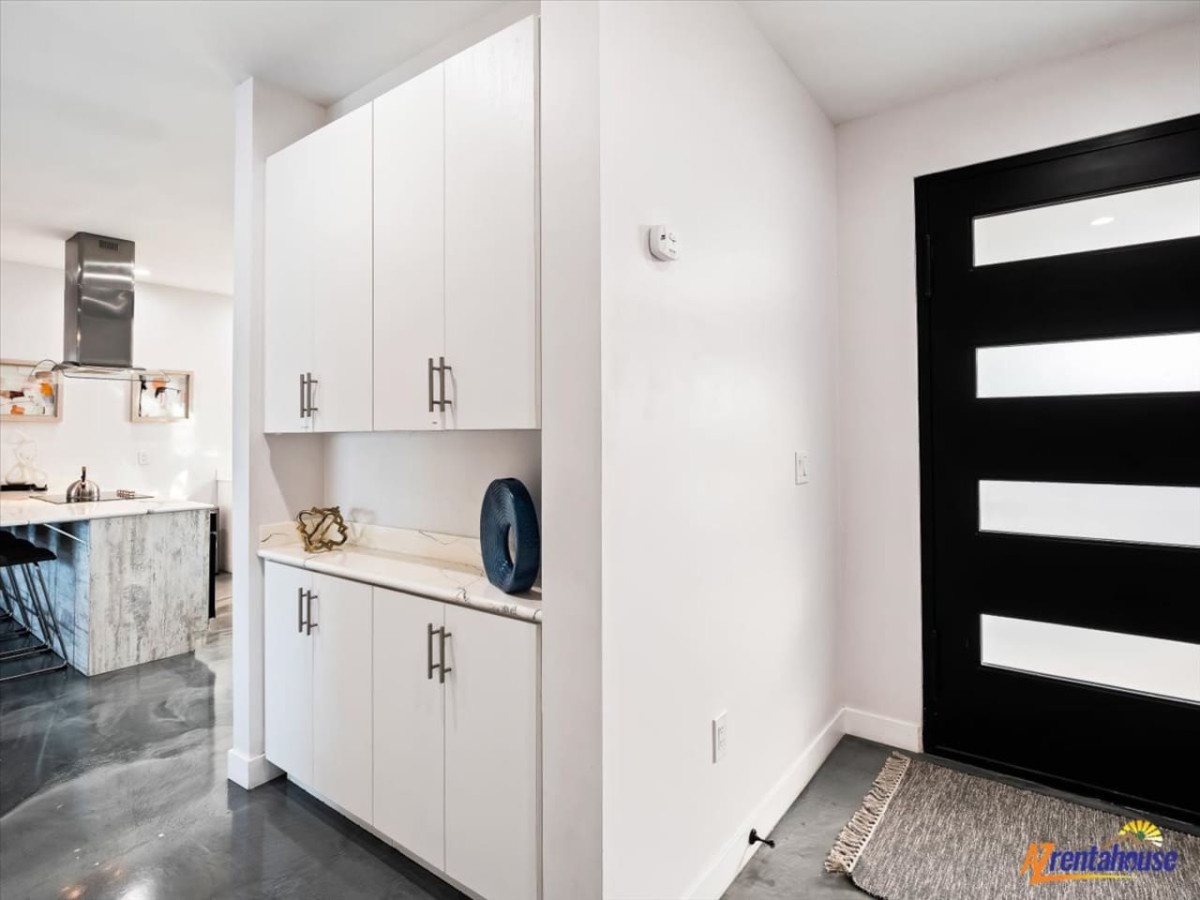 Step into your sleek entryway with custom storage solutions and modern design details that make arrival feel like coming home.