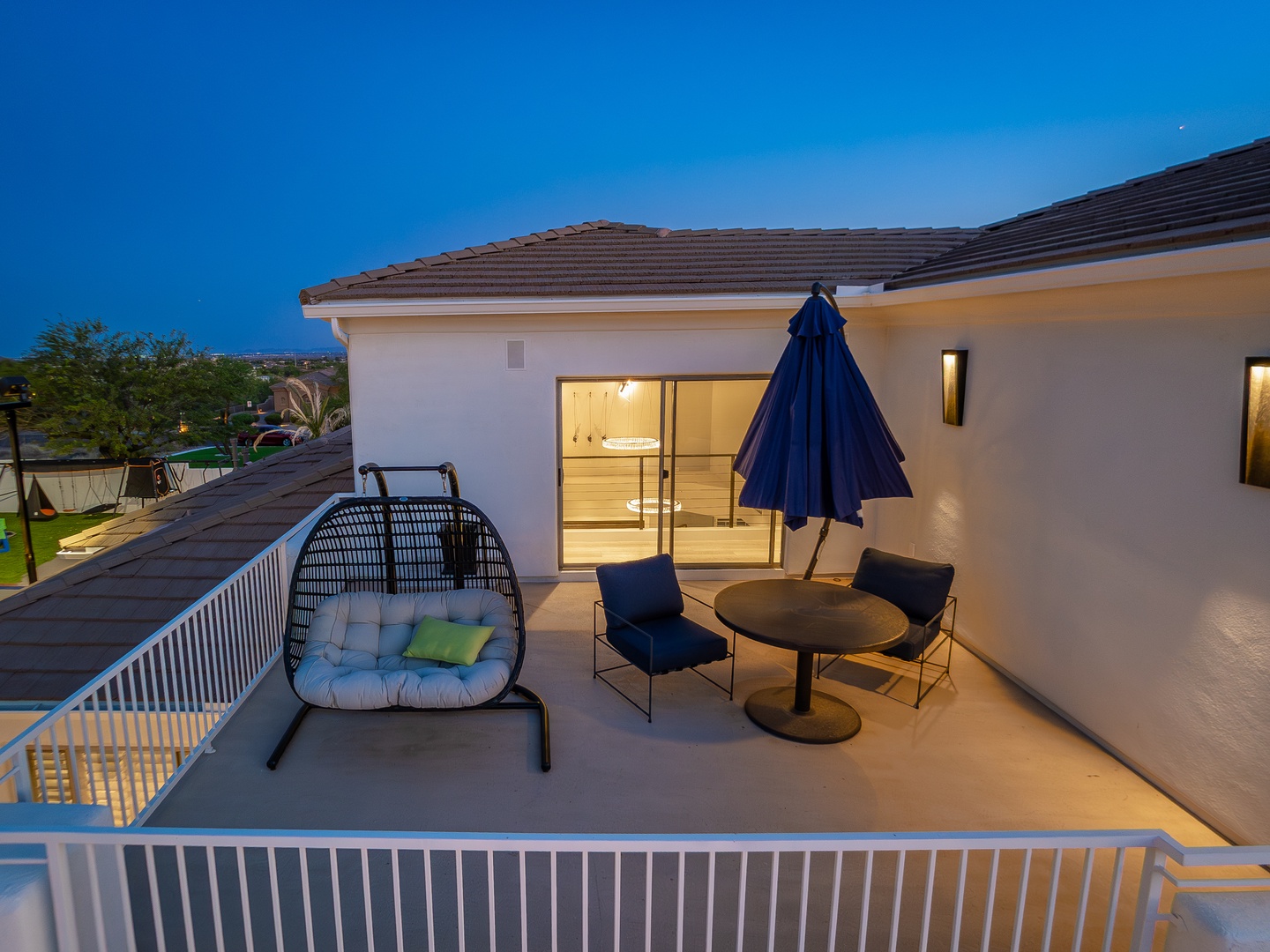 Relax under the stars on your private rooftop terrace, where cozy seating and a stylish swing chair await. Watch the evening lights twinkle across the neighborhood as day melts into twilight.