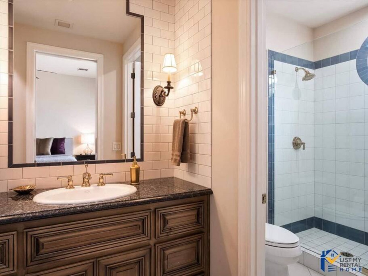 Your private bathroom features elegant subway tiles, granite counters, and a spacious walk-in shower for ultimate comfort.