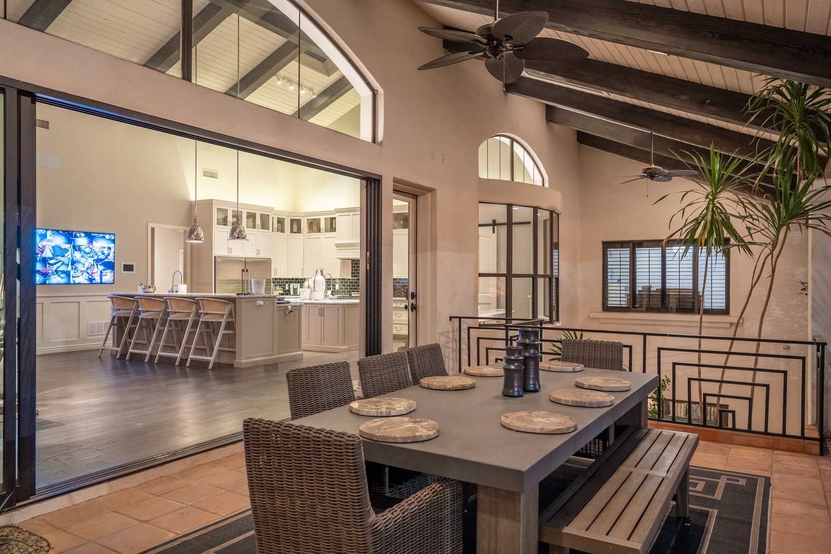 Dine under the stars on your covered terrace, then step inside to your chef's kitchen—perfect for seamless indoor-outdoor living and memorable evenings with loved ones.