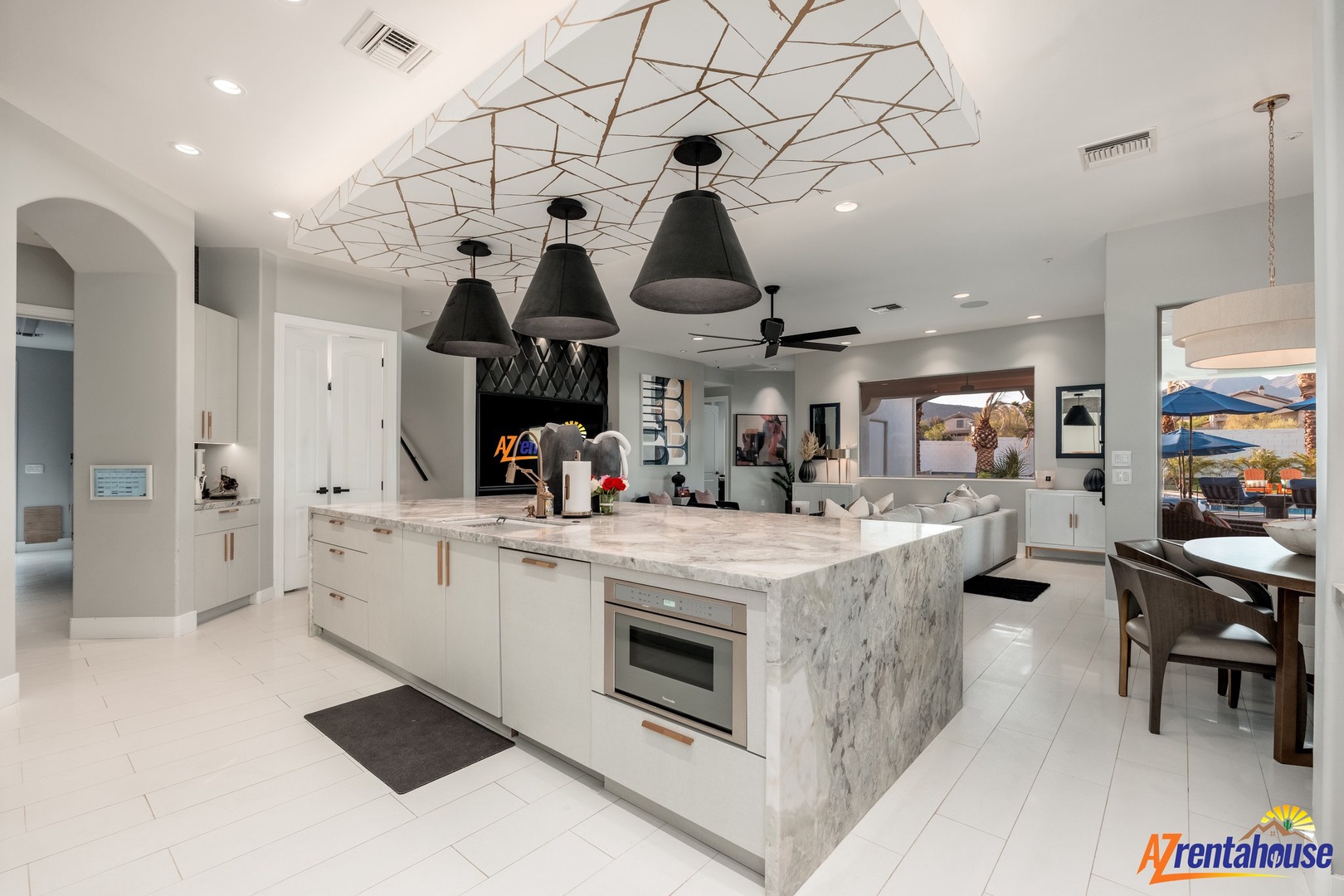 Your stunning open-concept kitchen awaits with marble countertops, designer pendant lights, and sleek appliances perfect for culinary adventures.