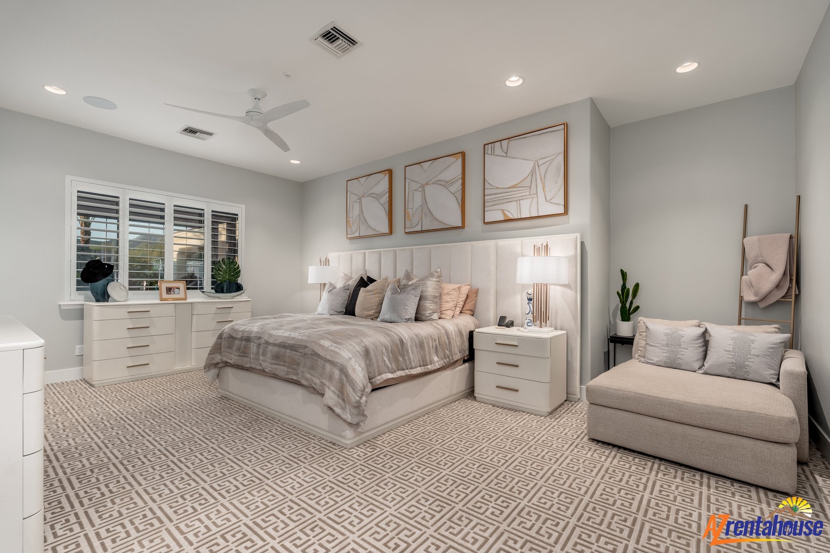 Unwind in your spacious bedroom sanctuary with plush bedding, modern furnishings, and a cozy reading chair for ultimate relaxation.