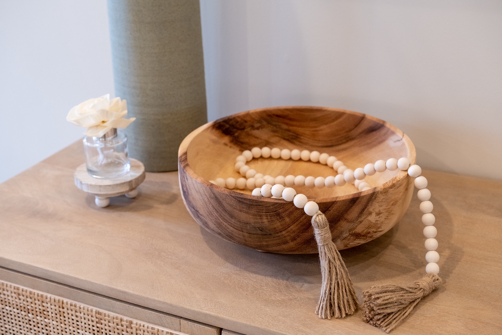 A serene vignette welcomes you with natural textures and mindful details—handcrafted wood, calming neutrals, and artful touches that set a peaceful, grounded tone for your stay.