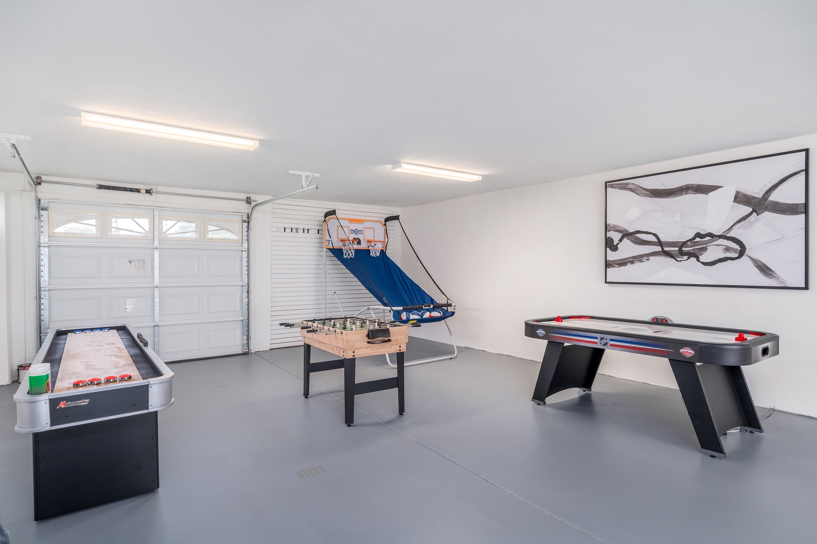 Your private game room awaits with arcade-style basketball, air hockey, billiards, and foosball—endless entertainment for the whole group right here.