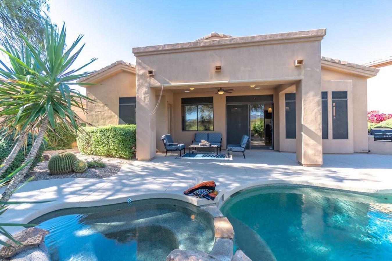 Modern desert retreat with private pool and spa, perfect for sunny Arizona relaxation.