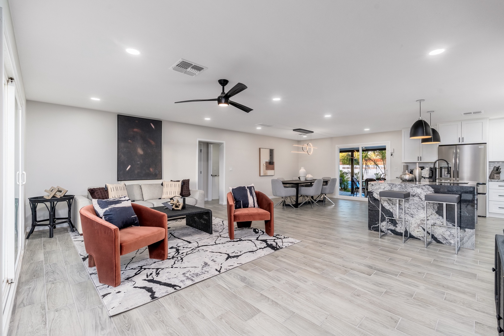 Unwind in your bright, open living area, where modern style meets total comfort. Gather around the kitchen island, relax on plush seating, or simply enjoy the effortless flow between spaces.