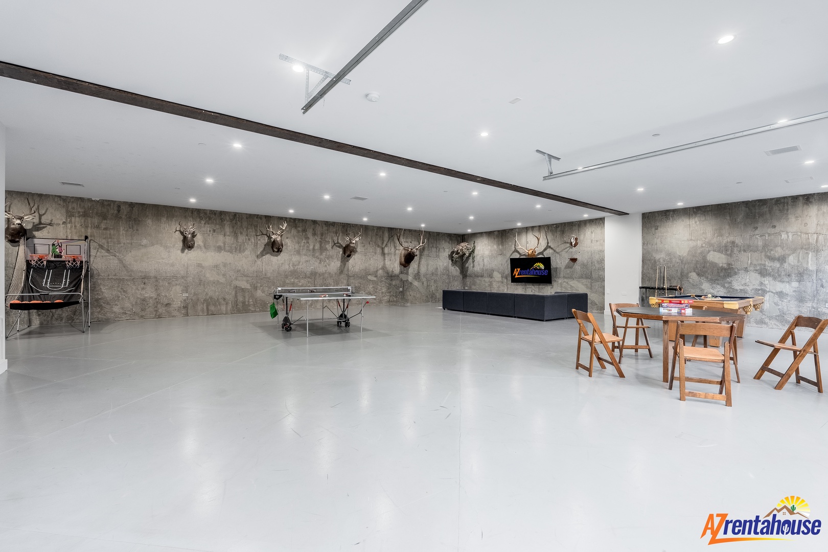 Your private entertainment space features polished floors, TV lounge, and game table—perfect for relaxing evenings with friends and family.