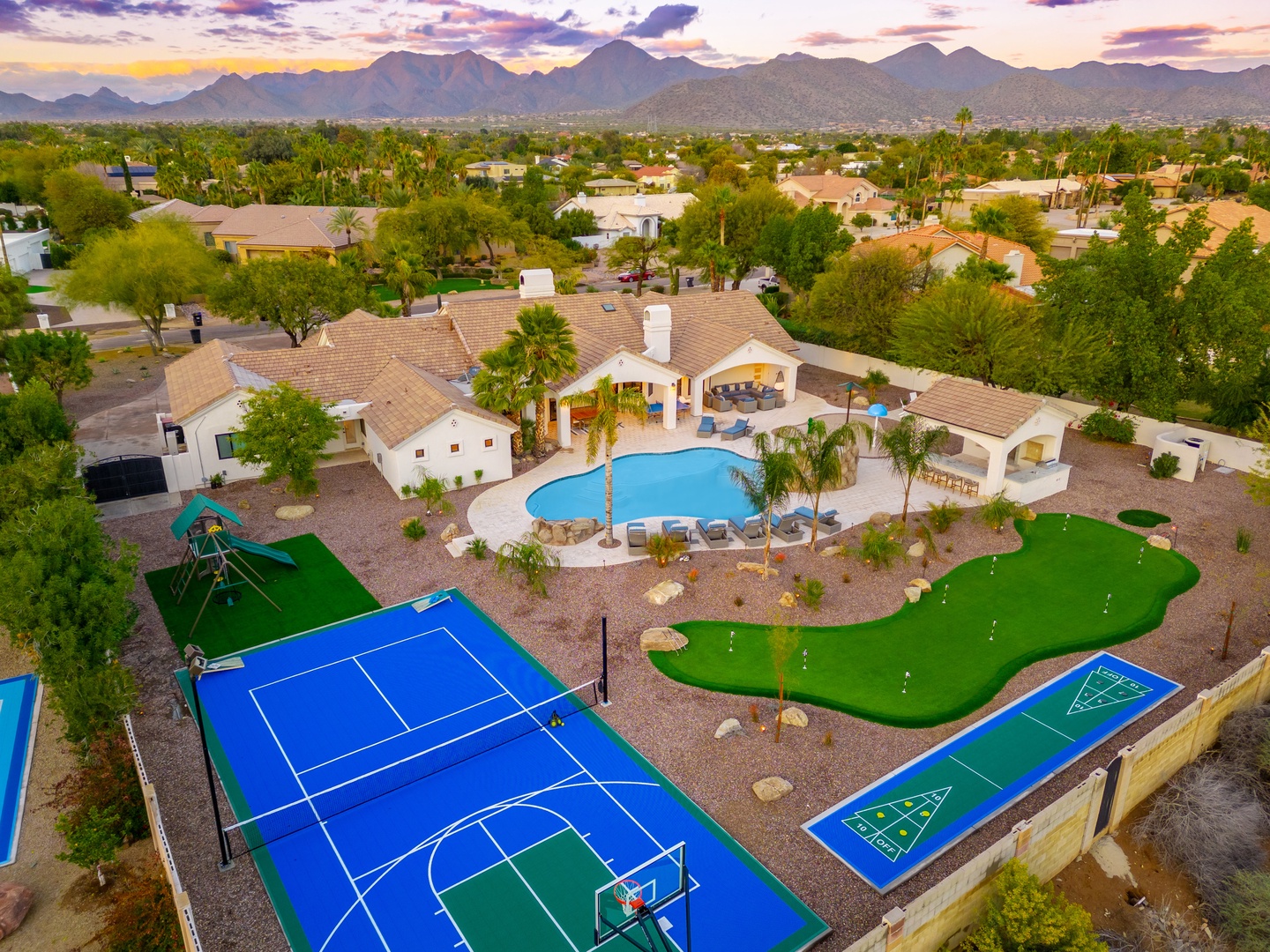 This scenic vacation rental features a private pool, sport court, putting green, covered patio, and mountain backdrop—all located in a quiet neighborhood near downtown.