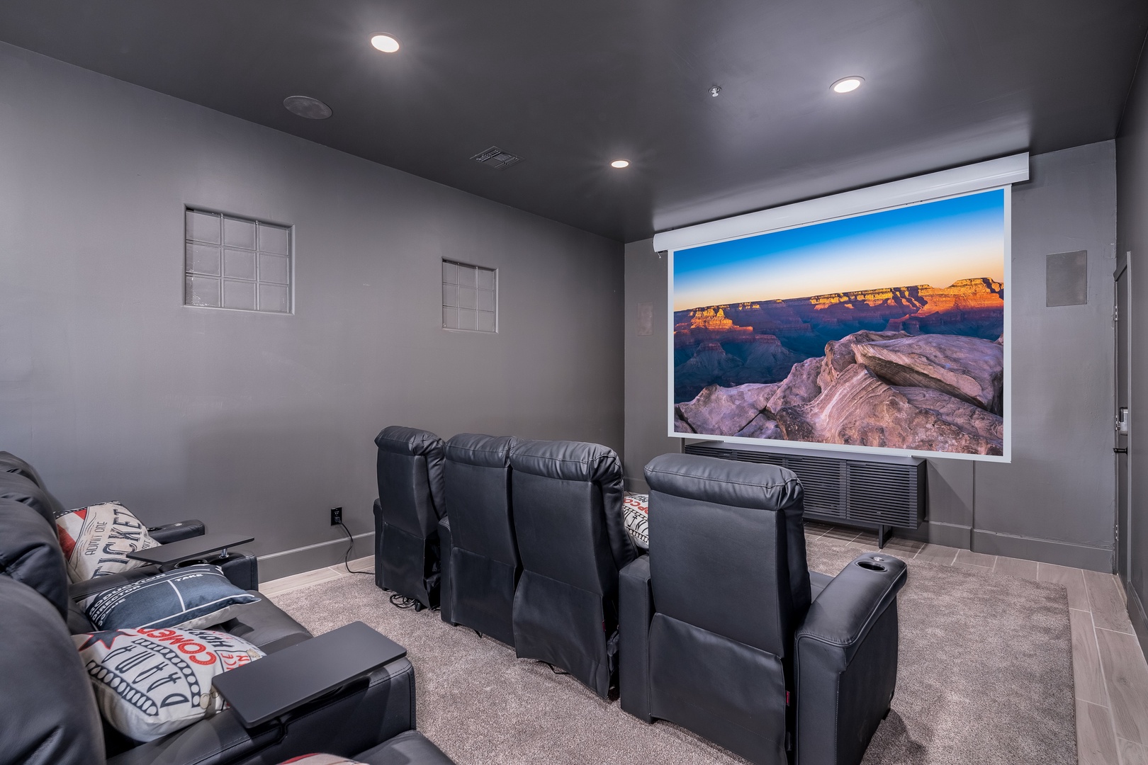 Settle into plush theater seating and enjoy epic movie nights on the large projection screen in your own private home cinema.