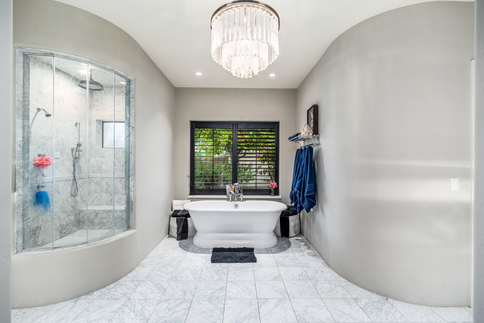Slip into your own private spa retreat, where a sparkling chandelier and elegant soaking tub await your arrival after a day of adventure.