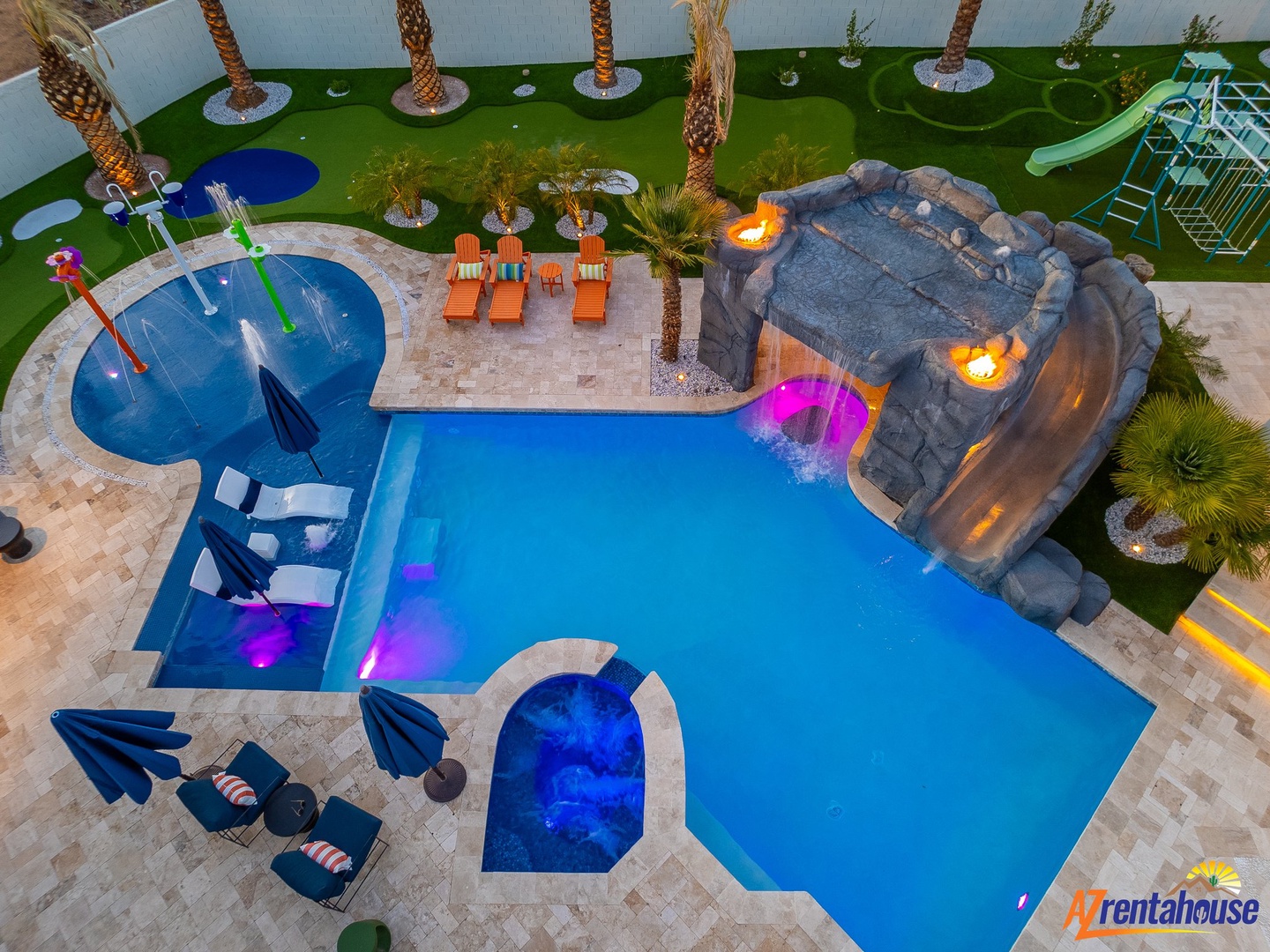 Dive into your private oasis with a stunning pool, relaxing hot tub, and tropical waterfall feature—perfect for memorable vacation moments.