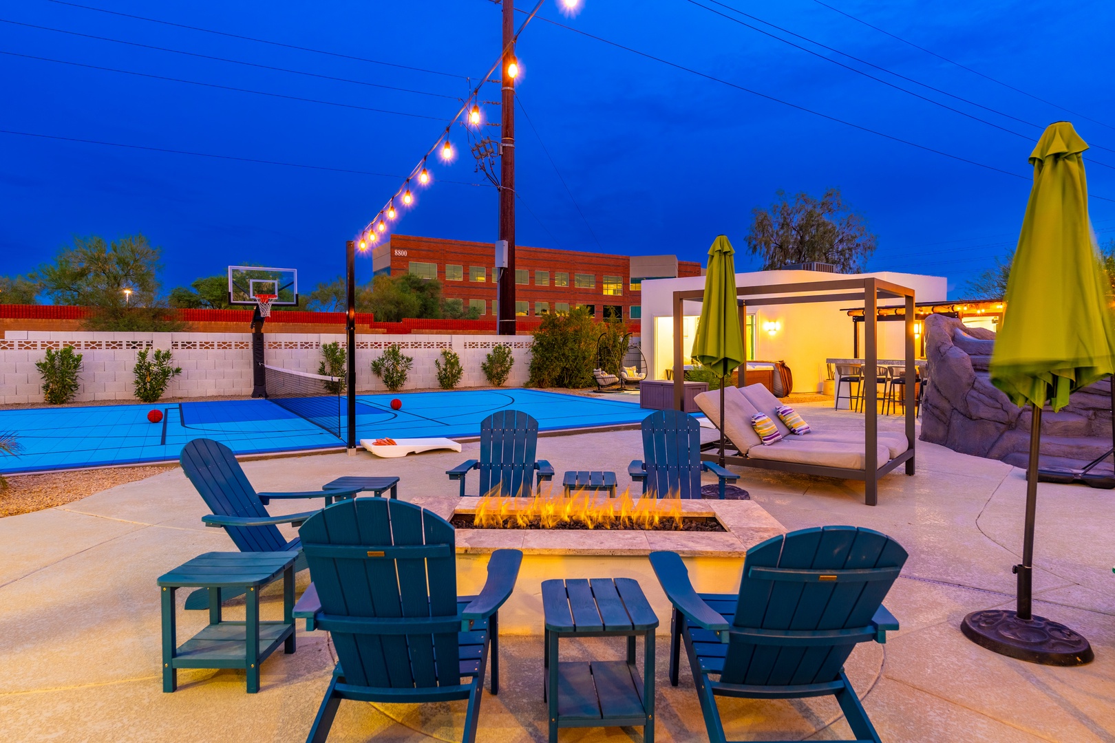Picture yourself unwinding around the glowing fire pit as twilight deepens, or challenging friends to basketball before cooling off in the sparkling blue pool—your private desert oasis awaits.