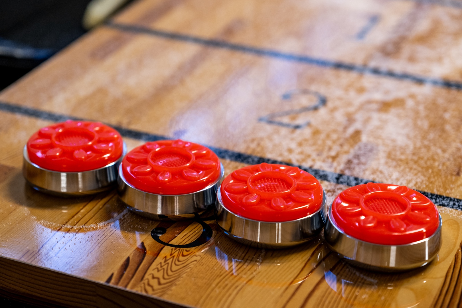 Traditional game pieces rest on a beautifully aged wooden board, inviting you to enjoy classic entertainment during your stay.