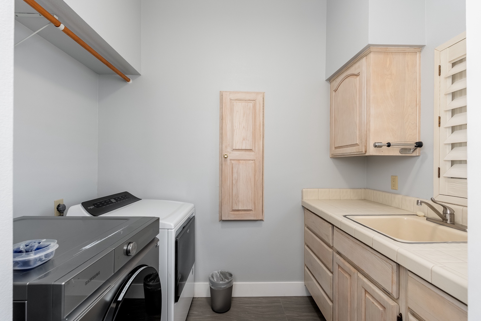 Your dedicated laundry space features a washer and dryer, ample counter for folding, and generous storage to keep your vacation wardrobe fresh and organized throughout your stay.