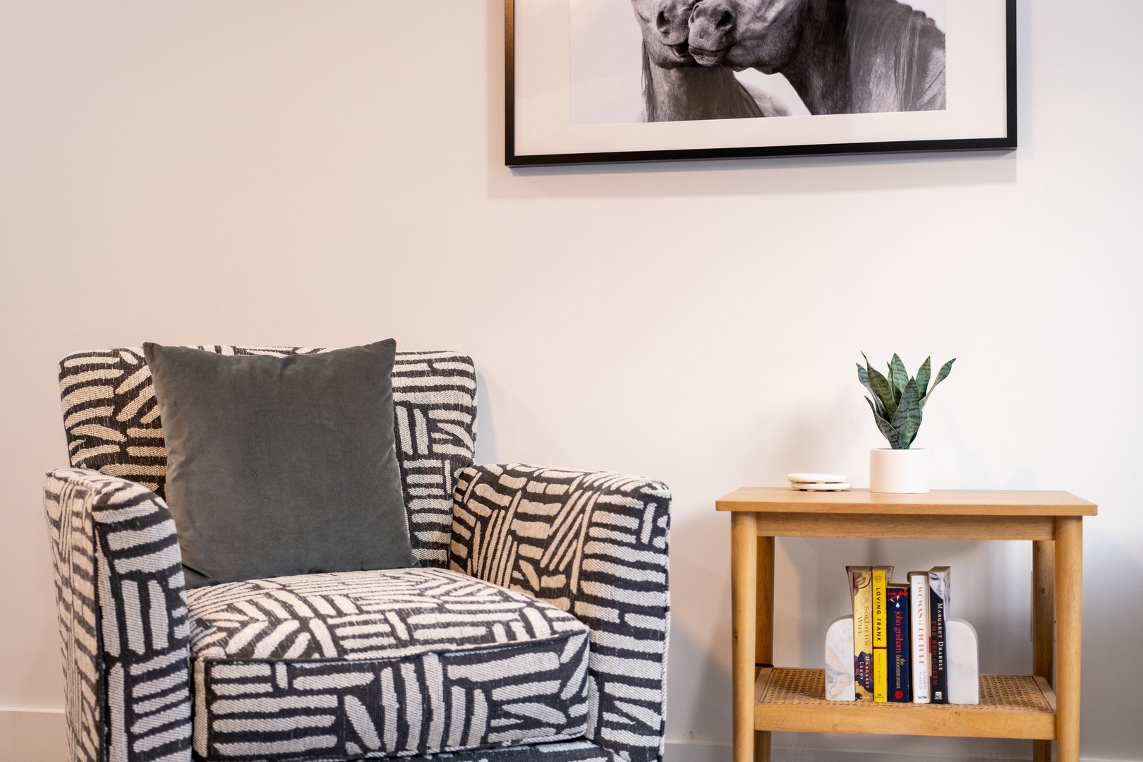 Curl up with a good book in this cozy reading corner. A stylish patterned armchair invites you to relax, while the side table keeps your favorite reads within reach.