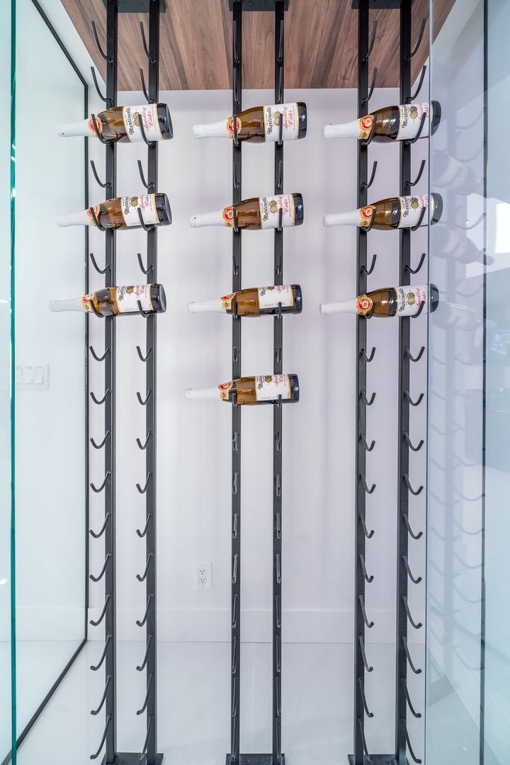 A dramatic floor-to-ceiling wine rack brings sleek, modern sophistication to your space, showcasing your favorite bottles with style.