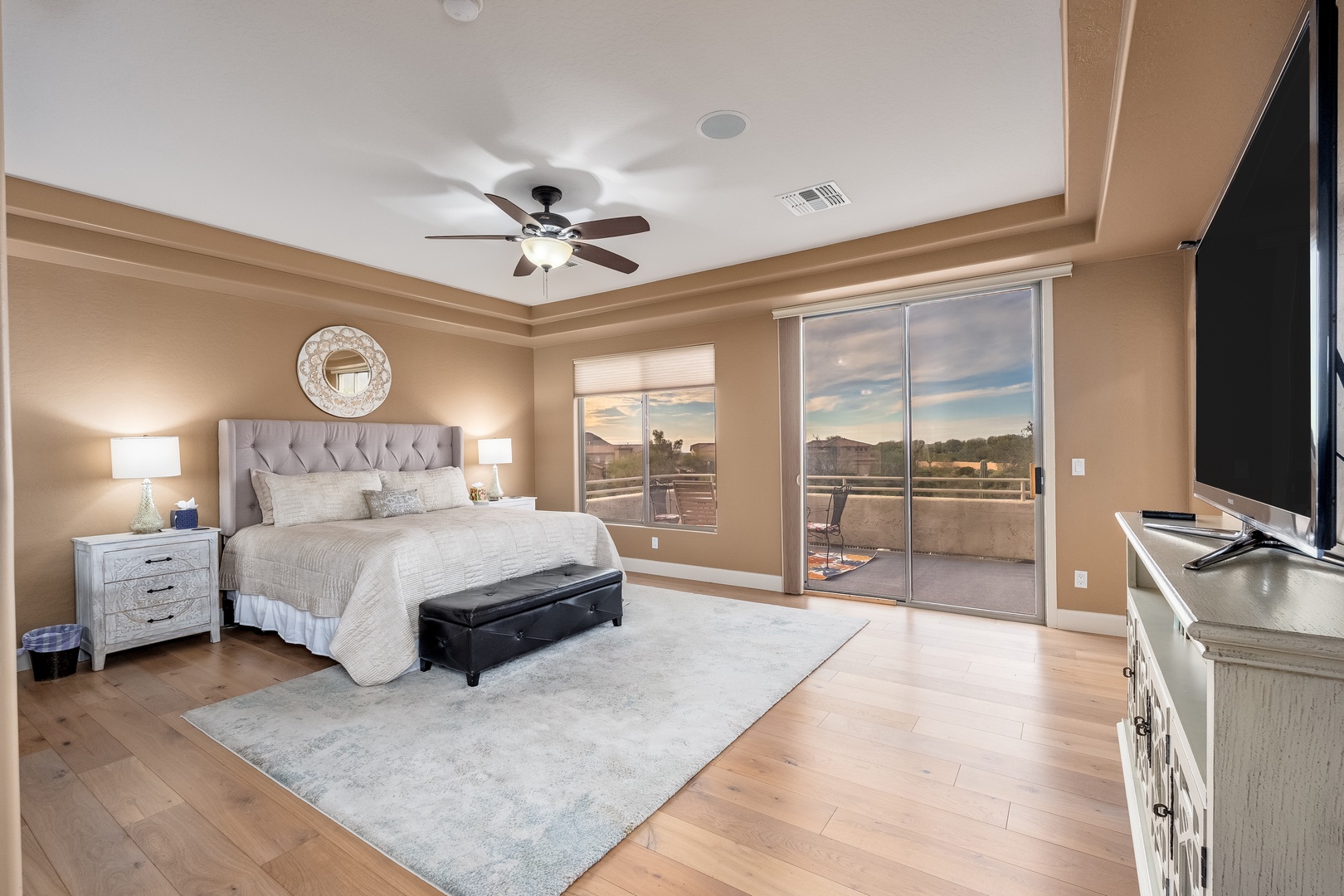 Unwind in your spacious suite where a plush bed, cozy seating, and private terrace await. Natural light floods the room, and a ceiling fan keeps you comfortable all day long.