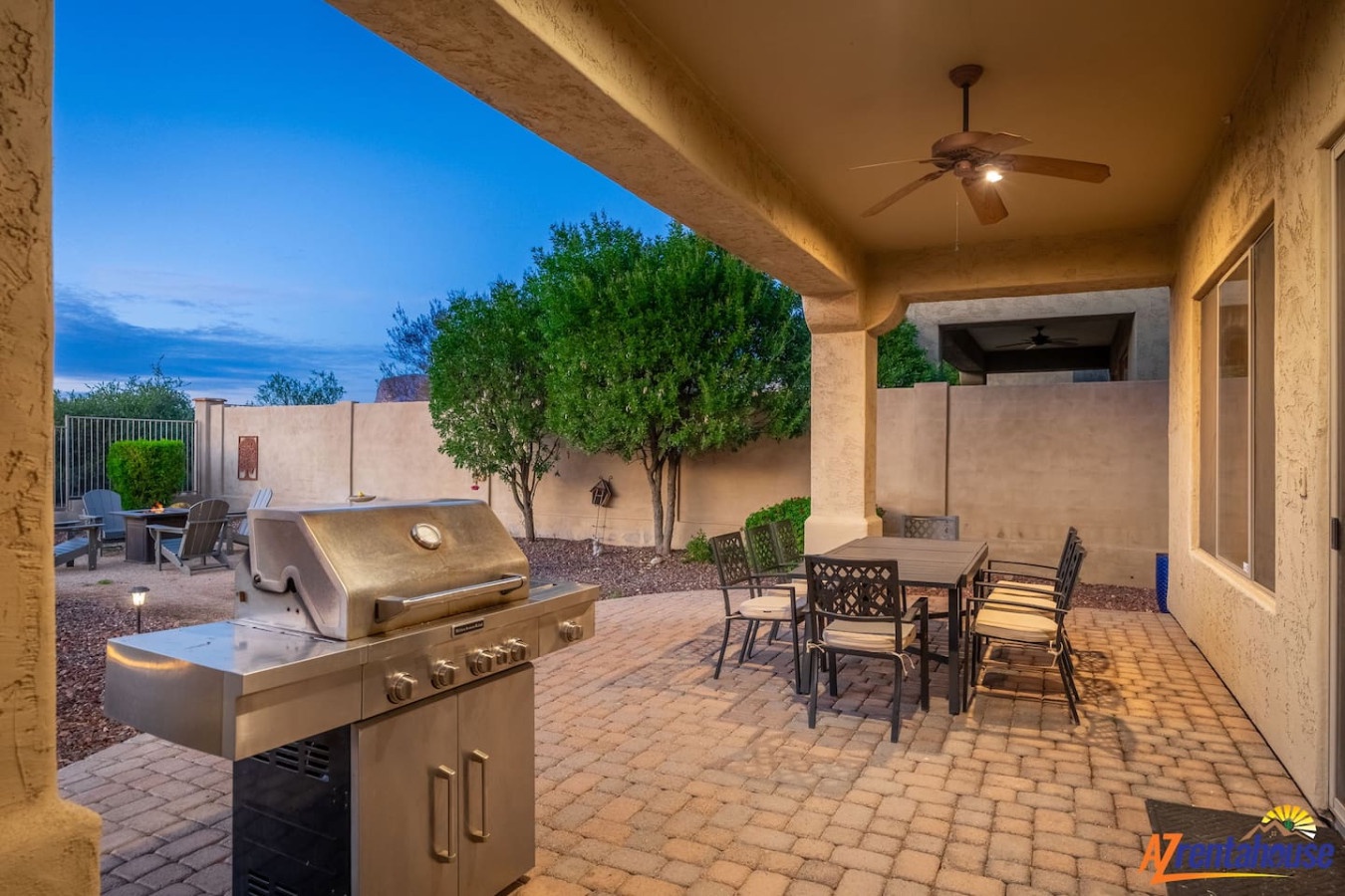 Your private covered patio awaits with a premium BBQ grill and dining space for memorable evenings under the desert sky.
